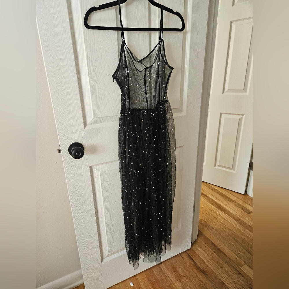Black Star sheer dress with slit in front and glitter and glitter stars one size